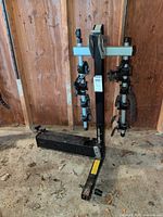 Full view of Thule hitch bike rack upright showing cradles and folding base