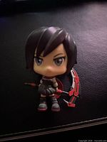 Front view of Ruby Rose chibi figure showing facial features, outfit and scythe
