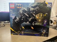 Front of sealed LEGO 76265 box showing set name, piece count, age recommendation and minifigure images