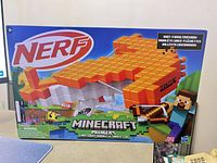 Front of sealed box showing Nerf Minecraft Pillager’s Crossbow artwork