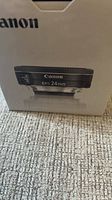 Canon EF-S 24 mm lens front view on box