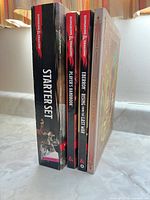 Spine view of Starter Set box and three hardcover books