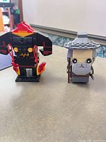 Front view of Balrog and Gandalf figures