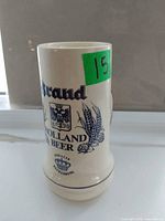 Stein front showing Brand Holland Beer logo