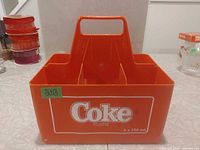 Front view showing Coke logo and six compartments