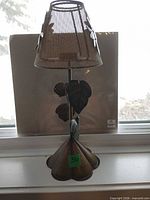 Full view of lamp-style metal tealight candle holder