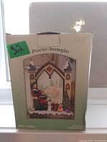 Front of original box showing product image and Porte-bougie text