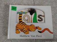 Front cover showing title, author, and tiger illustration