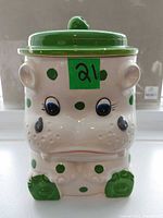 Front view of hippo cookie jar showing overall design and coloring
