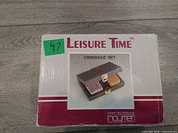 front of retail box showing Leisure Time cribbage set