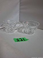 Top view of crystal creamer and sugar showing pattern and interiors