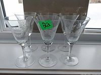 Full set of six etched crystal stem glasses front view