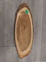 Full view of oval live edge wood cutting board