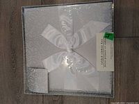 Front view of sealed folded ribbon gift box