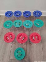 All containers arranged by lid color showing quantity and extra lid