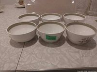 Six Alfred Meakin Hereford bowls grouped, exterior pattern visible