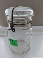 Full view of jar showing glass lid and wire clasp