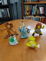 All five figurines displayed on tabletop