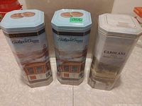 Front view of all three tins side by side