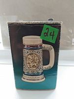 Front of box showing image of stein