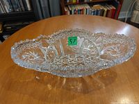 Top view of entire oval cut crystal serving dish showing pinwheel pattern and sawtooth rim