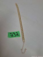 Full view of anklet laid straight showing links and extender chain