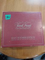 Closed maroon box showing Baby Boomer Edition branding