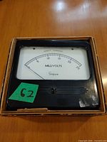 Front view of Simpson panel meter in box showing dial 0-15 mV