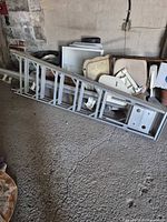 Full view of 6 ft aluminum ladder on garage floor