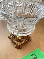 top view showing cut glass pattern and brass base