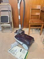 Full view of canister vacuum with hose, wand, power nozzle and vacuum bags