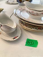 Stack of plates, Woodland Rose gravy boat, white gravy boat