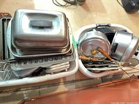 Two bins with roasting lid, sheet pans, saucepans, utensils