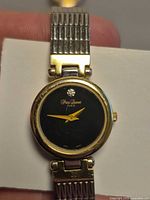 Black dial Pierre Laurent watch close-up showing dial, bezel and part of bracelet