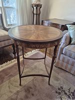 Full view of round walnut veneer side table