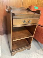 front view showing drawer, shelves, overall design