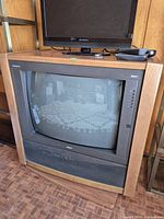 Front view of RCA wood console CRT television