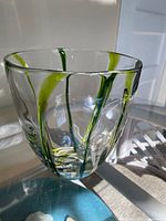 Oblique view showing overall vase shape and green swirl pattern