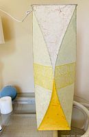 Front view of rectangular paper shade pendant lamp showing colour panels and overall shape