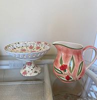 Pedestal bowl and pitcher side by side for scale and style