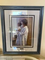 Full view of framed Robert Duncan print with frame and mat visible