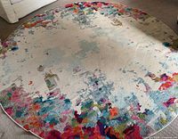 Full view of round rug showing overall pattern and condition