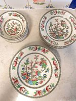 Stacked bowls and plates showing Indian Tree pattern