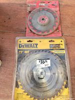 Both sealed saw blades in packaging
