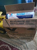 Closed Valvoline box showing branding and one cartridge partially visible