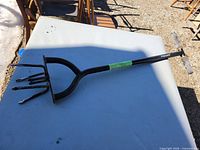 Full view of Fiskars extended-reach tiller on table