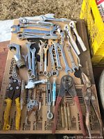 Overview of entire lot of wrenches, pliers, snips, air chuck, turnbuckle, marker