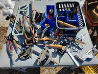Overall view of assorted tools and bins on table