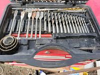upper layer of case showing spade bits, twist bits, hole saw set