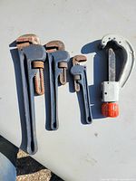 Group shot showing Ridgid pipe cutter and three Mastercraft pipe wrenches